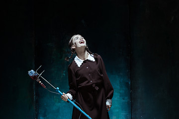 Image showing Portrait of a young girl in school uniform as a vampire woman