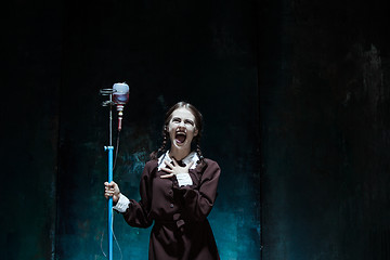 Image showing Portrait of a young girl in school uniform as a vampire woman