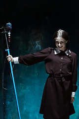 Image showing Portrait of a young girl in school uniform as a vampire woman