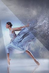 Image showing The beautiful ballerina dancing in blue long dress 