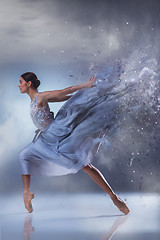 Image showing The beautiful ballerina dancing in blue long dress 