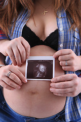 Image showing pregnancy woman with ultrasound photo