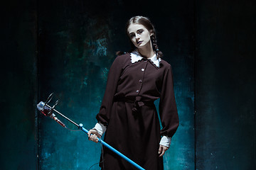 Image showing Portrait of a young girl in school uniform as a vampire woman