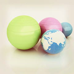 Image showing Pilates fitness ball and earth. 3D illustration. Vintage style.