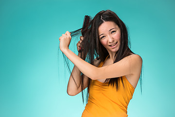 Image showing Frustrated young woman having a bad hair