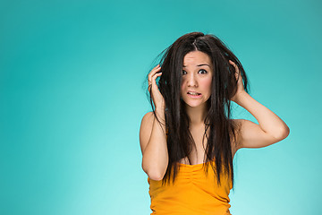 Image showing Frustrated young woman having a bad hair