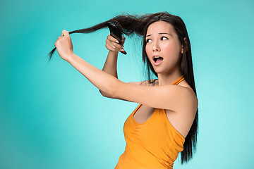 Image showing Frustrated young woman having a bad hair