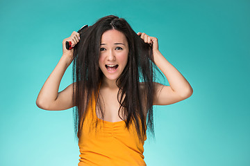 Image showing Frustrated young woman having a bad hair