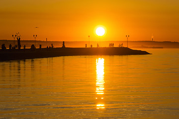 Image showing Hot orange sundown on lake