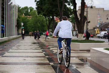 Image showing young hipster man with fixed gear bike on city street