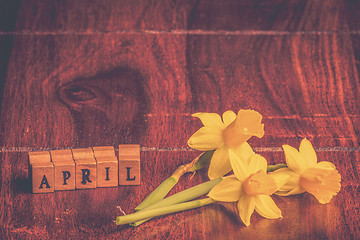Image showing Daffodils in april on wooden table