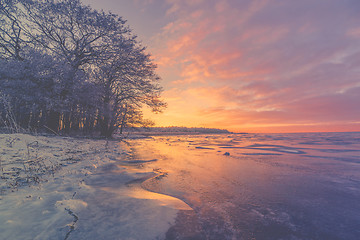 Image showing Violet sunrise over a frozen lake