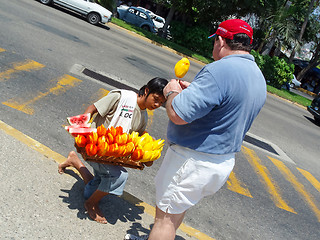 Image showing Boy selling fruits in Acapulco