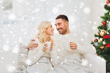 Image showing happy couple at home with christmas tree