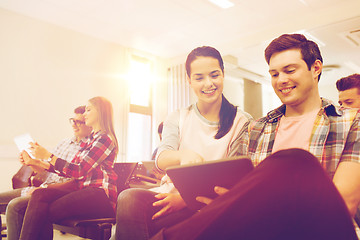 Image showing group of smiling students with tablet pc