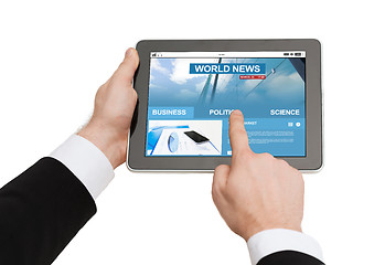 Image showing close up of hands with business news on tablet pc