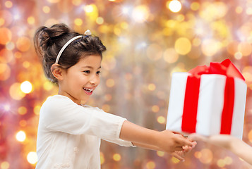 Image showing smiling little girl with gift box