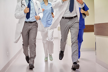 Image showing close up of medics or doctors running at hospital