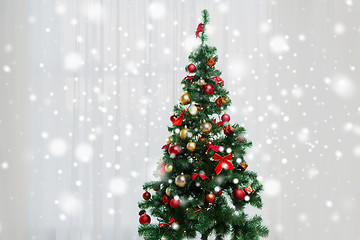 Image showing christmas tree in living room over window curtain