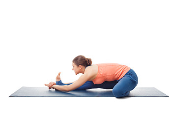 Image showing Woman doing Ashtanga Vinyasa Yoga asana Janu sirsasana