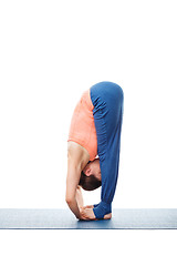 Image showing Woman doing Ashtanga Vinyasa Yoga asana Padahastasana