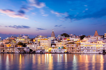 Image showing Evening view of  illuminated houses on lake Pichola in Udaipur