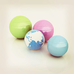 Image showing Pilates fitness ball and earth. 3D illustration. Vintage style.