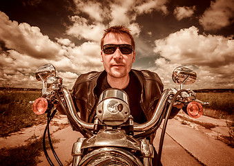 Image showing Biker on a motorcycle