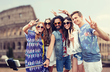 Image showing hippie friends with smartphone selfie stick