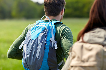 Image showing close up of couple with backpacks hiking outdoors