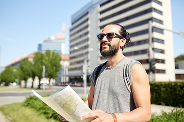 Image showing man traveling with backpack and map in city