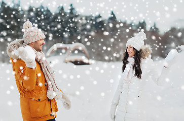 Image showing happy couple playing snowballs in winter