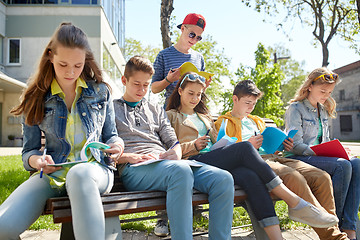 Image showing group of students with notebooks at school yard