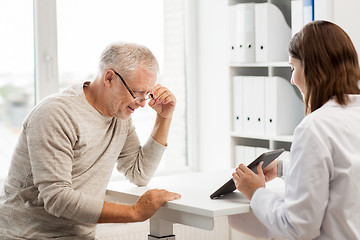 Image showing senior man and doctor with tablet pc at hospital