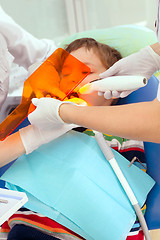 Image showing Boy and dentist during a dental procedure