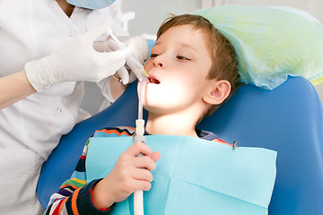 Image showing Boy and dentist during a dental procedure