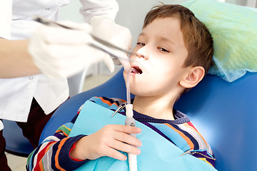 Image showing Boy and dentist during a dental procedure