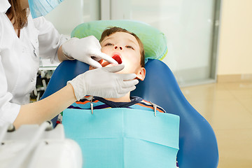 Image showing Boy and dentist during a dental procedure