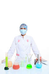 Image showing Woman chemist and chemicals in flasks