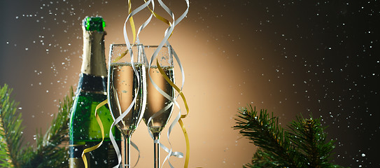 Image showing Champagne glasses decorated ribbons. Merry Christmas and happy new year