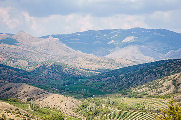 Image showing Panoramic views of valley, forests, hills and mountains