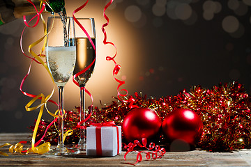 Image showing Champagne fills the glasses and festive Christmas decorations