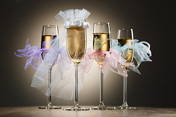 Image showing Beautiful decorated wedding glasses with champagne