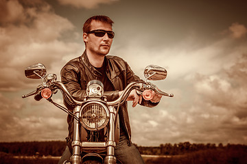 Image showing Biker on a motorcycle