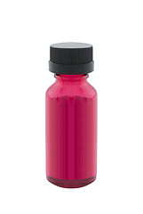 Image showing Bottle of red liquid isolated