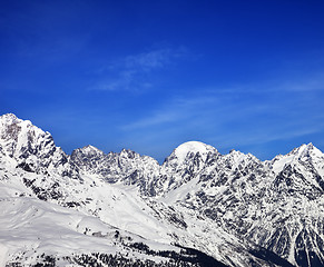 Image showing Snow mountains and blue sky in winter at sun day