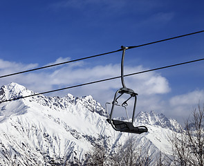 Image showing Ski lift in snow winter mountains at nice sunny day