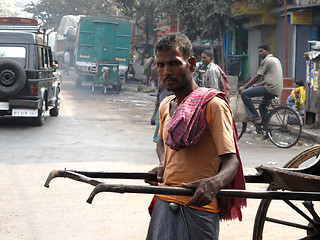 Image showing Streets of Kolkata. Portrait of a rickshaw driver