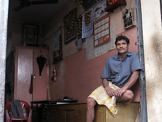 Image showing Streets of Kolkata. notary sitting in his office