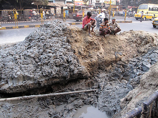 Image showing Streets of Kolkata. People repair the road